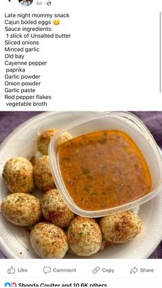 a white plate topped with lots of food next to a bowl filled with meatballs