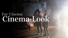 two people standing next to each other in front of a truck with the words for cinema cinema look