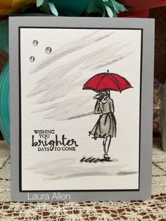 a card with a drawing of a woman holding an umbrella and saying, wishing brighter days to come