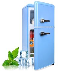 a blue refrigerator sitting next to an ice bucket and some mints on the table