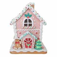 a pink and white gingerbread house ornament