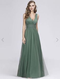 a woman in a long green dress