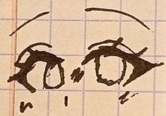 an eye drawn on top of a piece of paper