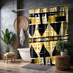 a bathroom with a yellow and black shower curtain next to a white bathtub in front of a brick wall