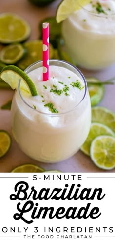 a close up of a drink on a table with limes