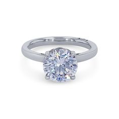 a white gold engagement ring with a round brilliant diamond