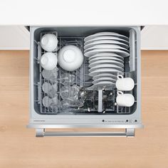 an open dishwasher with dishes in it