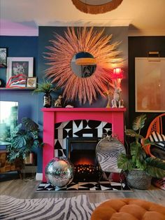 a living room filled with furniture and a fire place next to a wall mounted mirror