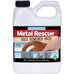 a gallon of metal rescue rust remover bath with a hand holding the end of it