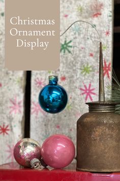 a christmas ornament display with ornaments