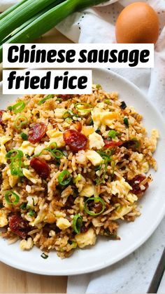 a white plate topped with rice and veggies next to an egg