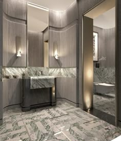 an elegant bathroom with marble floors and walls