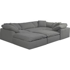 a grey sectional sofa with pillows on it