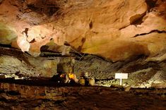 the inside of a cave filled with lots of rocks