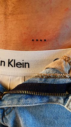 the back of a man's stomach with an inscription on it that reads, john kein