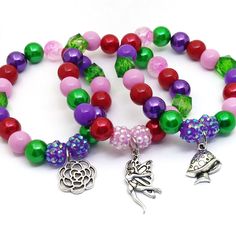 These adorable stretchy bracelets are the perfect favor for your little one's Enchanted party! Each bracelet features a Tibetan silver charm, resin rhinestone beads and a beautiful assortment of red, purple, pink and green 10mm acrylic beads strung with durable stretch floss cord. Each bracelet will arrive individually packaged in organza bags. To be the first to know about new items, sales and giveaways, mark my shop as a favorite! Follow Beaded Perfection on Instagram for special offers and co Whimsical Adjustable Beaded Bracelets For Party, Fairy Style Adjustable Jewelry For Gifts, Whimsical Beaded Charm Bracelet For Gift, Whimsical Multicolor Charm Bracelet For Gift, Multicolor Fairy Style Jewelry Gift, Fairy Style Multicolor Jewelry Gift, Fairy Style Multicolor Jewelry For Gifts, Whimsical Multicolor Charm Bracelet Gift, Whimsical Beaded Adjustable Charm Bracelet