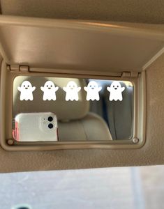 there are five ghost stickers on the mirror