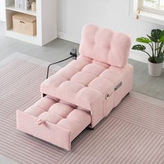 a pink reclining chair sitting on top of a rug