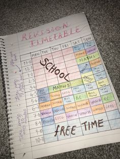 a notebook with some writing on it that has been placed in front of the calendar