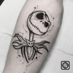 a black and white image of a skeleton holding a knife in its hand with the moon behind it