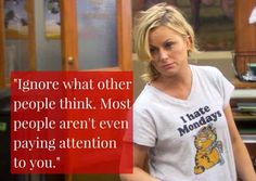 a woman standing in front of a desk with a sign on it that says ignore what other people think most people aren't even paying attention to you