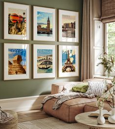 a living room filled with furniture and pictures on the wall