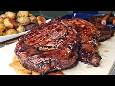 some meat and potatoes on a cutting board