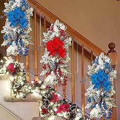 christmas decorations on the banisters are decorated with red, white and blue ribbons