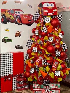 a christmas tree decorated with cars and balloons