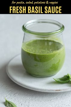 fresh basil sauce in a glass jar on a white plate with the title above it