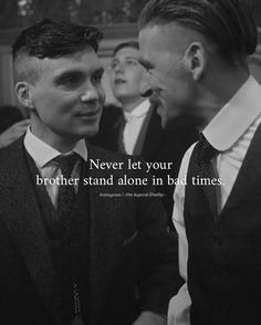 two men standing next to each other with a quote on the front and back of them