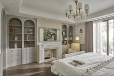 a bedroom with a fireplace and built in bookshelves