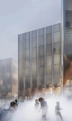 several people are in the water with steam coming out of their mouths and behind them is a large building