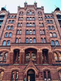 an old brick building with many windows