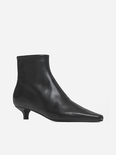 Toteme's The Slim black leather ankle boots featuring a pointed toe, side zip fastening, leather sole and kitten heel. Composition: 100% calfskin Black Leather Ankle Boots, Sneaker Wedge, Kitten Heel, Yoga Wear, Manolo Blahnik, Leather Ankle Boots, Luxury Boutique, Valentino Garavani, High Heel Shoes