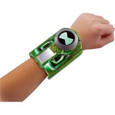 a person's arm with a green wristband and an electronic device on it