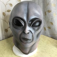 an alien head is sitting on a table