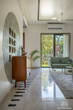 a living room filled with furniture and a large window