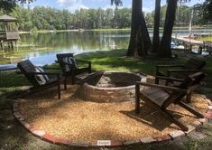 an outdoor fire pit surrounded by lawn chairs