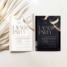 two different types of wedding cards with gold foil and ribbon on them, next to a palm tree