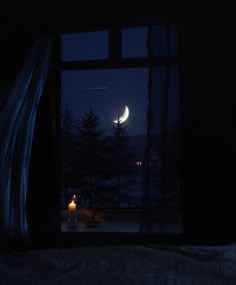 the moon is seen through an open window at night with candles in front of it