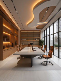 an empty conference room with chairs and desks in front of large windows that look out onto the outdoors