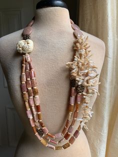 Sweet Olive Boho Necklace w Hand Carved Bone, Mother of Pearl Branch, Blush Agate, Sunstone & Copper Details. Longest Strand Measures 40". Sweet Olive Jewelry Pouch. Oc Details, Avatar Ocs, Navi Oc, Olive Jewelry, Boho Mother, Stone Necklaces, Carved Bone, Stone Beaded Necklace