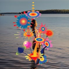 a woman is standing in the water surrounded by colorful flowers and circles on her body