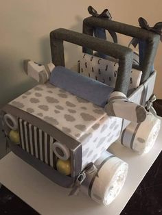 a cake made to look like a jeep with decorations on the front and back wheels