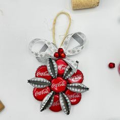 a christmas ornament made out of coca - cola cans