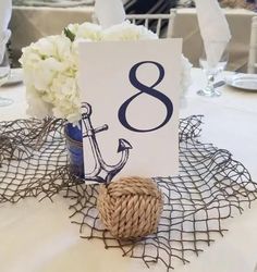 there is a table with a place card holder on it