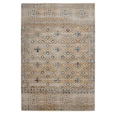 a beige and blue rug with an intricate design on the bottom, in front of a white background