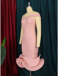 a mannequin with a pink dress on display