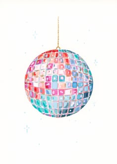 a colorful ornament hanging from a gold chain on a white background with snowflakes